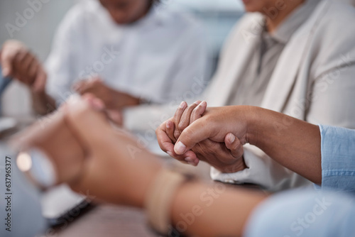 Praying, holding hands and support with business people in office for meeting, community and gratitude. Worship, hope and counseling with closeup of group of employees for trust, teamwork and faith