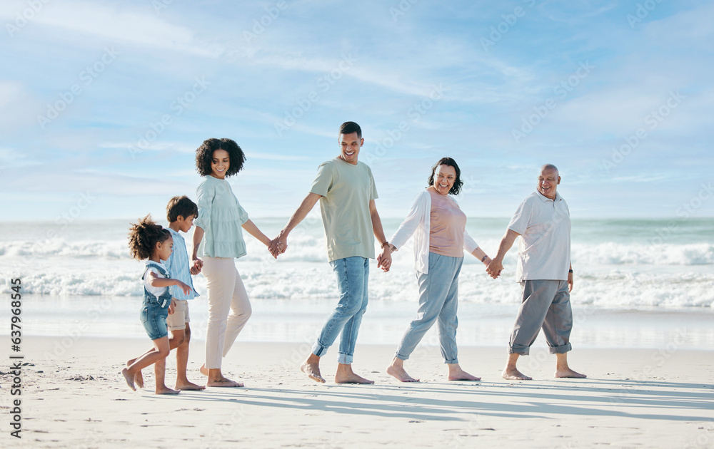Summer, beach and a family holding hands while walking on the sand by the ocean or sea together. Grandparents, parents and children outdoor in nature for travel, vacation or holiday on the coast