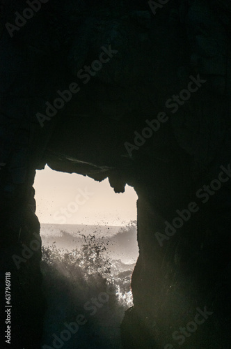 Detail of the Keyhole arch at Pfeiffer beach  with the setting sun to be just behind it.