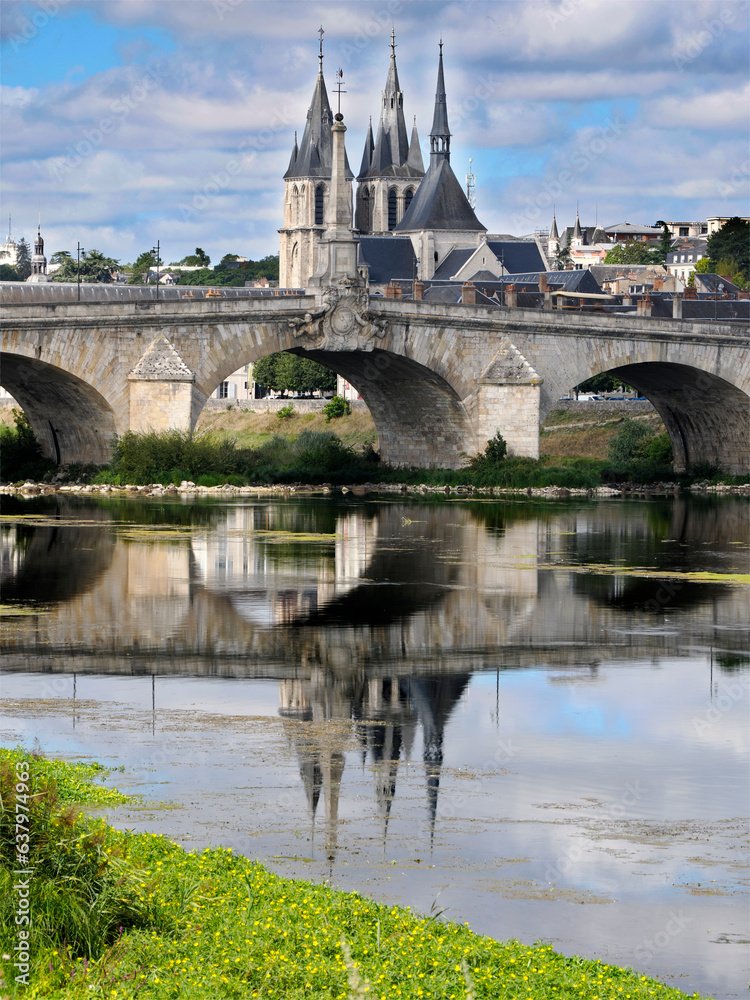 Bridge Jacques-Gabriel over the Loire river and Saint Nicholas church at Blois, a commune and the capital city of Loir-et-Cher department in Centre-Val de Loire, France Bridge Jacques-Gabriel over the Loire river and Saint Nicholas church at Blois, a commune and the capital city of Loir-et-Cher department in Centre-Val de Loire, France