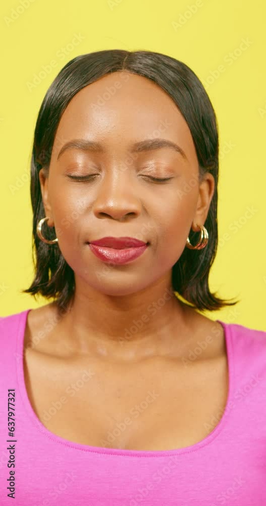 Beautiful Black woman breathes and meditates, feeling relax happy, yellow studio Beautiful Black woman breathes and meditates, feeling relax happy, yellow studio