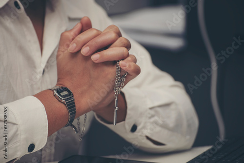 Prayer and jesus cross concept. Asian female praying, hope for peace and free from war, Hand in hand together by woman, believes and faith in christian religion at church.
