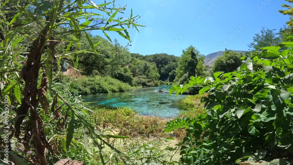 Transparent and turquoise waters in The Blue eye or Syri i kalter, a natural phenomenon in the mountains of southern Albania Transparent and turquoise waters in The Blue eye or Syri i kalter, a natural phenomenon in the mountains of southern Albania
