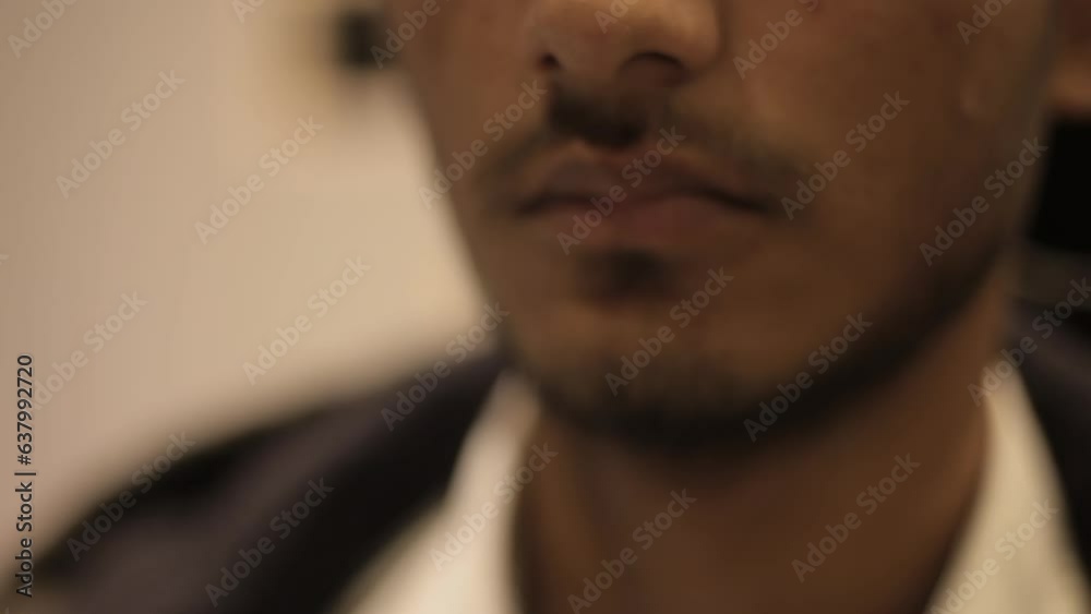 Cinematic close-up shot of a young employee stressed sweating uncomfortable and anxious while working on a hard project, Creative lighting used. HD Footage - 24 fps - ProRes Cinematic close-up shot of a young employee stressed sweating uncomfortable and anxious while working on a hard project, Creative lighting used. HD Footage - 24 fps - ProRes