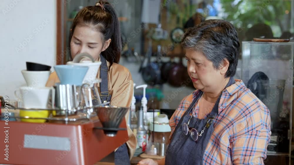 Small startup business owner concept. two successful baristas women, family mother and daughter happy helping each other making coffee with positive energy.  