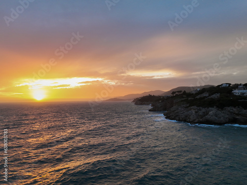 Coastline at sunset by drone