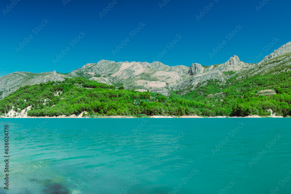 A beautiful mountain landscape, a view of the mountains and a lake with turquoise water, there is a place for an inscription. High quality photo