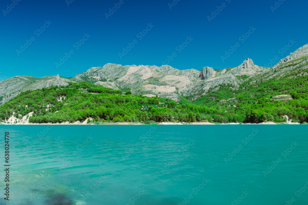 A beautiful mountain landscape, a view of the mountains and a lake with turquoise water, there is a place for an inscription. High quality photo A beautiful mountain landscape, a view of the mountains and a lake with turquoise water, there is a place for an inscription. High quality photo