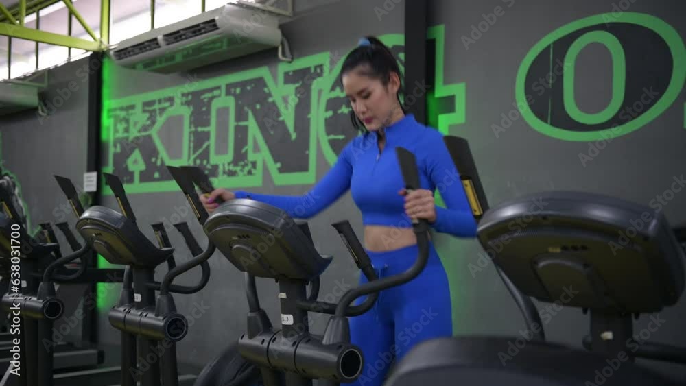 Sports Asian woman is exercise legs on a recumbent bike in the gym, workout concept Sports Asian woman is exercise legs on a recumbent bike in the gym, workout concept