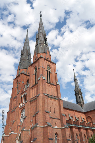 Uppsala Cathedral in Uppsala, Sweden on sky with clouds background