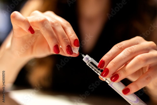 Woman holding an injection pen for diabetic