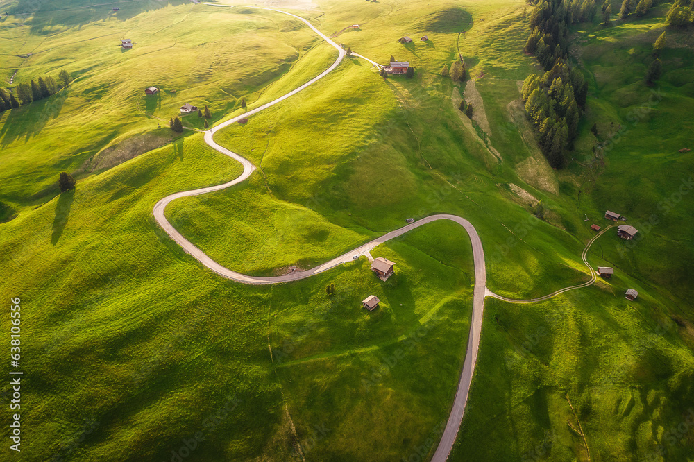 Aerial view of the plateau meadow on Alpe di Siusi, the Italian Dolomites in spring time at sunset