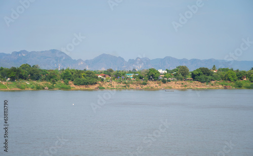 Aerial view of Mekong River with green mountain hill. Nature landscape background in Ubon Ratchathani, Thailand and Laos. © tampatra