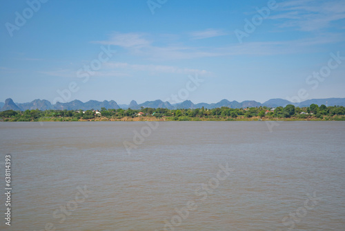 Aerial view of Mekong River with green mountain hill. Nature landscape background in Ubon Ratchathani, Thailand and Laos. © tampatra