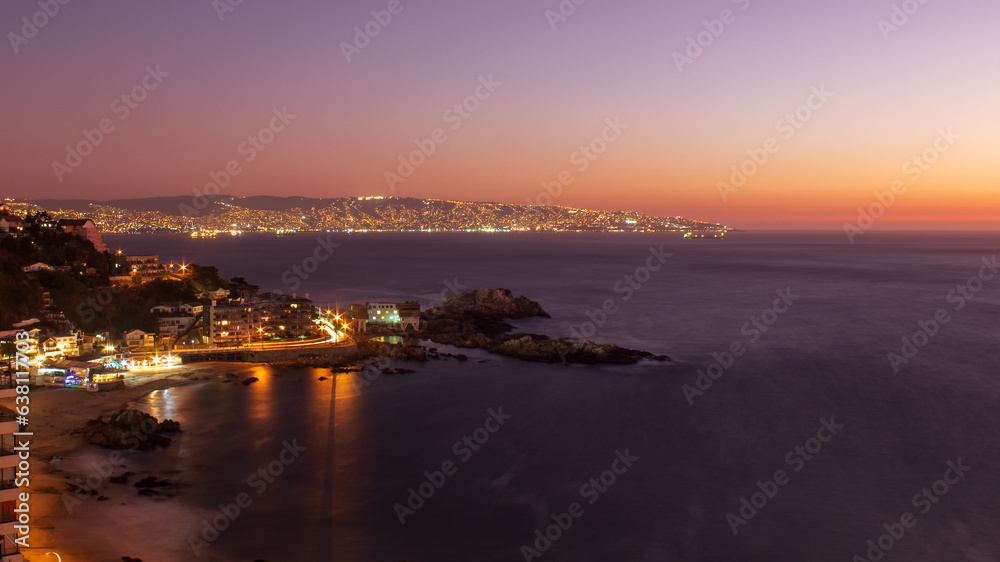 sunset over the city,  beach Cochoa,  Reñaca Vina del Mar beach, Valparaiso, Chile
