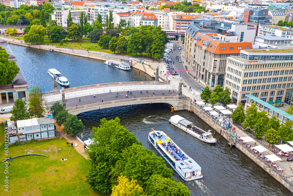 Skyline aerial view of Spree River and Museum island (Museumsinsel) in Berlin, Germany. Friedrichsbrucke bridge and Berlin touristic tour boats on the river