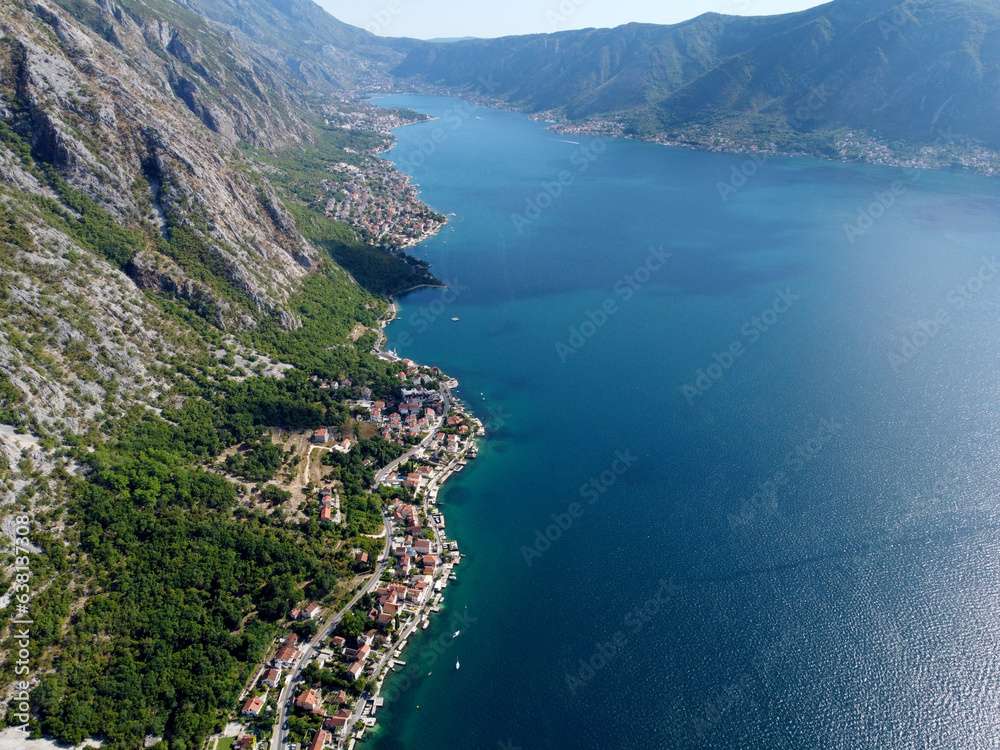 Aerial drone high view of Kotor bay, Boka Kotorska and coastal town Kotor, Cattaro, in Montenegro. Location place famous resort Montenegro. Adriatic fjord surrounded by rugged mountains