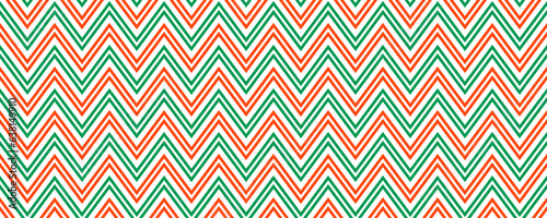 Candy cane zig zag seamless pattern. Red and green wavy stripe background. Christmas repeating decoration wallpaper. Winter holiday lines backdrop. Xmas peppermint package wrapping print. Vector