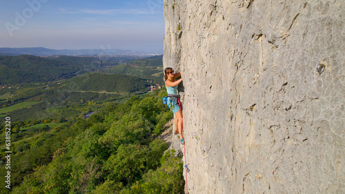 AERIAL: Incredible view from a rocky climbing wall at picturesque Karst Edge
