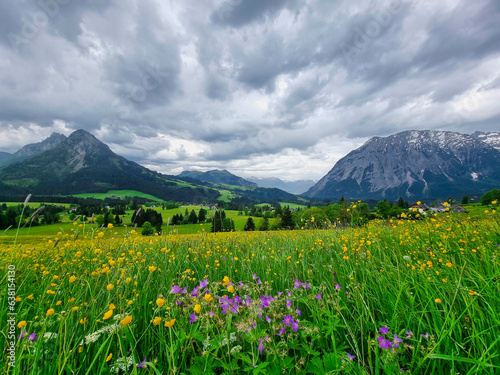 Summer austrian landscape with Grimming mountain (2.351 m), an isolated peak in the Dachstein Mountains, view from small alpine village Tauplitz, Styria, Austria