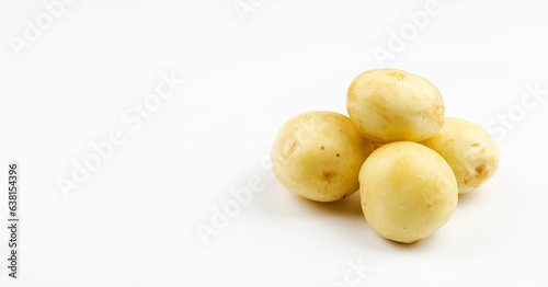 Four young potatoes are isolated on a white background. Fresh homegrown vegetables  young potatoes.