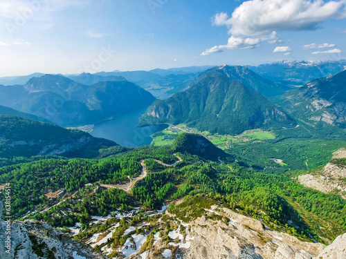 Amazing mountains panorama from "5 Fingers" viewing platform above Hallstatt village, Hallstättersee lake and the inner Salzkammergut region on Mount Krippenstein in the Dachstein Mountains, Austria.