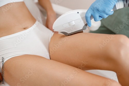 Closeup of female client on laser epilation procedure in beauty salon. Hair removal, cosmetology