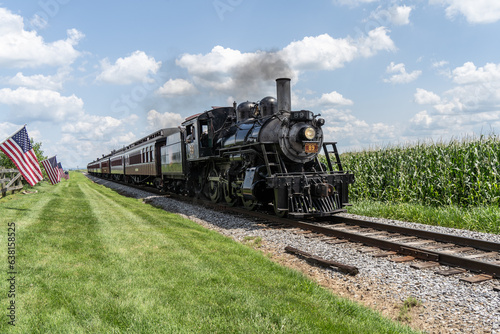 Strasburg  Pennsylvania     August 2023  Strasburg Steam Train rides along though corn fields in Lancaster County  Pennsylvania