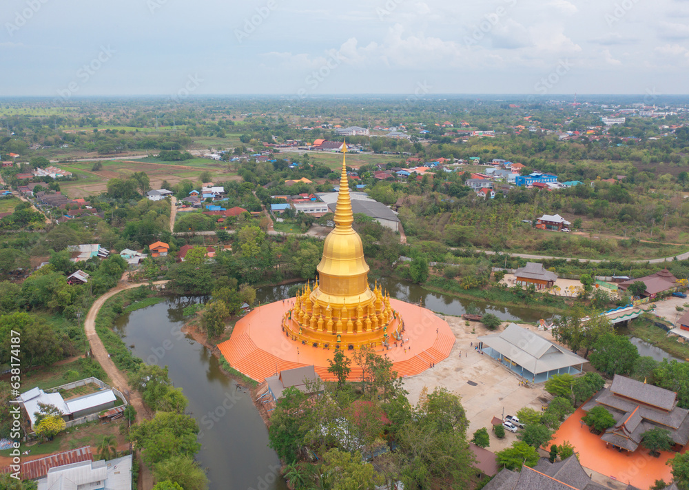 Naklejka premium Aerial top view of The Isan pagoda is a buddhist temple near Bangkok, an urban city town, Thailand. Thai architecture landscape background. Tourist attraction landmark.