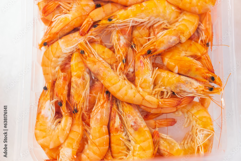 Shrimp on ice in a store fridge, background Shrimp on ice in a store fridge, background