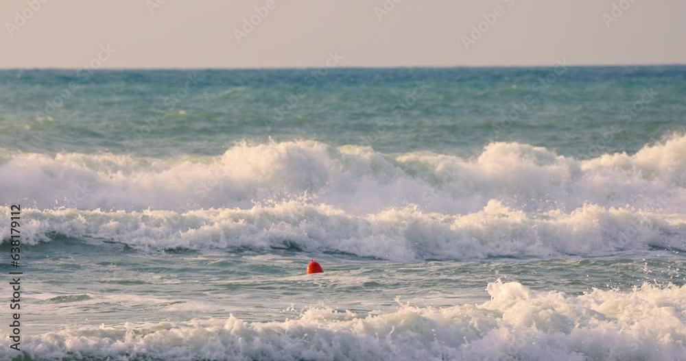 Ocean waves rolling and splashing toward tropical shore and beach sand, scenic sea sunrise Ocean waves rolling and splashing toward tropical shore and beach sand, scenic sea sunrise