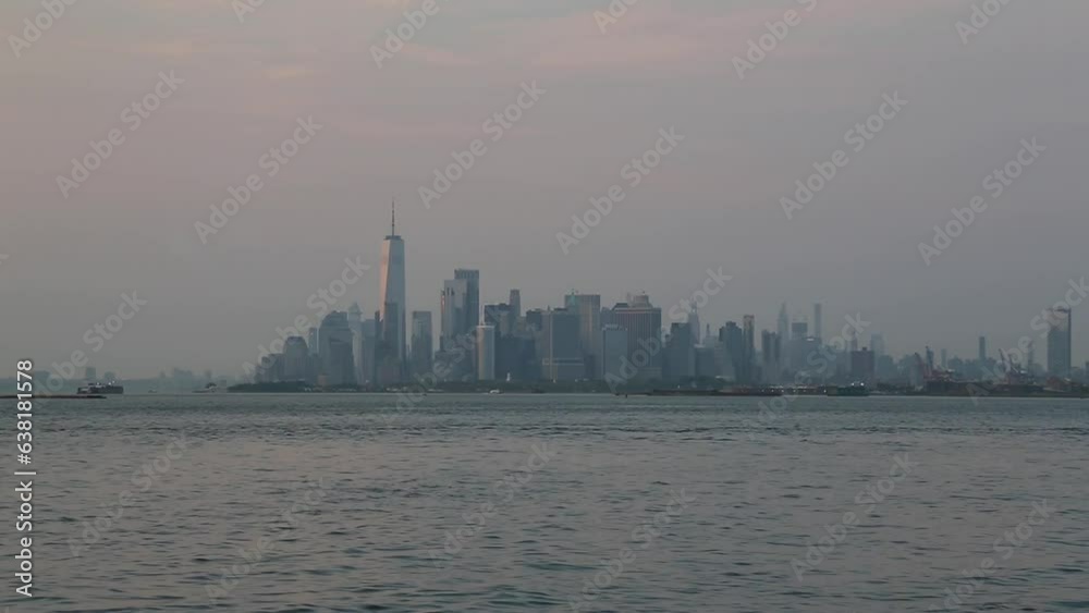 view of downton manhattan, new york city skyline with water moving (ferry, boat, skycraper) nyc harbor view of downton manhattan, new york city skyline with water moving (ferry, boat, skycraper) nyc harbor