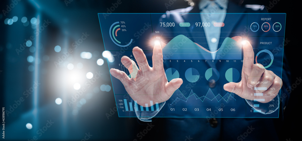 Businesswoman analyzes to chart data business on a visual screen dashboard, technology devices and screens visible in the background, financial planning, market research, and the stock market. Businesswoman analyzes to chart data business on a visual screen dashboard, technology devices and screens visible in the background, financial planning, market research, and the stock market.