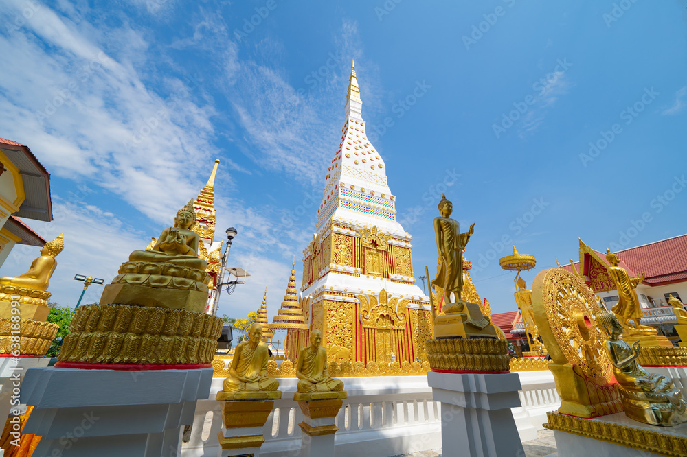Fototapeta premium Wat Phrathat Phanom, Nakhon Phanom, Isan Temple. The pagoda is a buddhist temple in urban city town, Thailand. Thai architecture landscape background. Tourist attraction landmark.