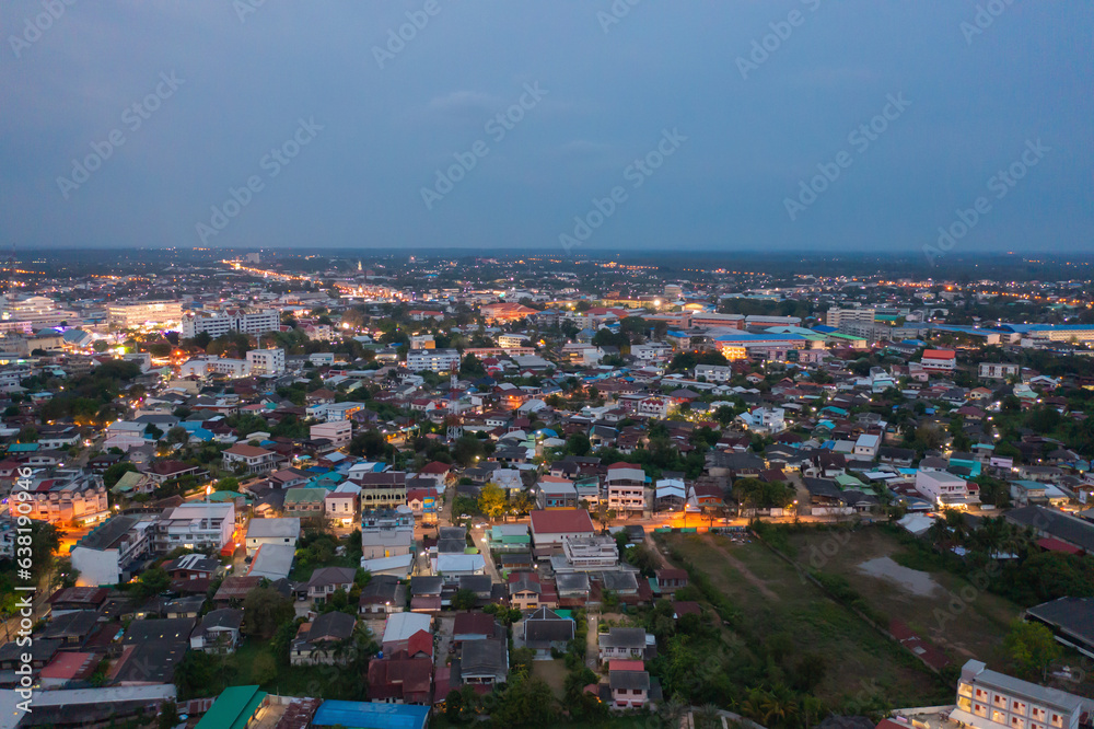 Aerial view of residential neighborhood roofs. Urban housing development from above. Top view. Real estate in Kalasin, Isan province city, Thailand. Property real estate at night.
