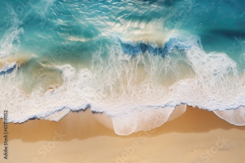 Top down view of sea waves crashing on the beach