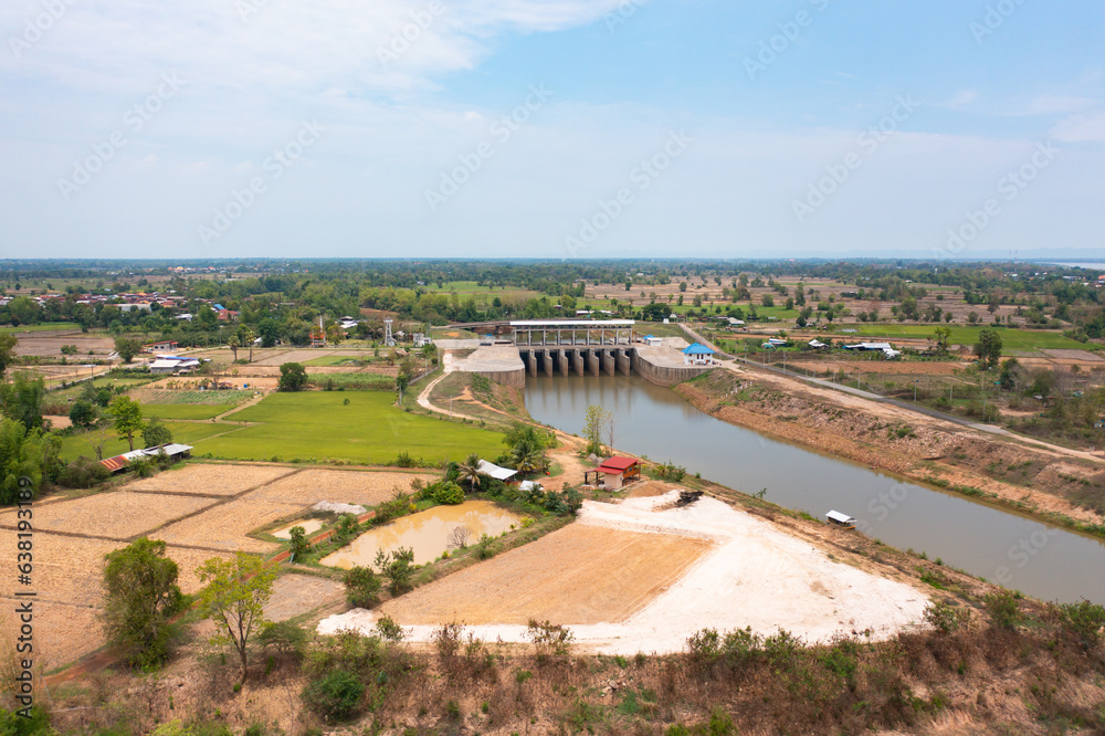 Aerial view of dam tower crane. Reservoir and sea water in recycle energy industry concept for electricity in Natural landscape background in Thailand. Environment.