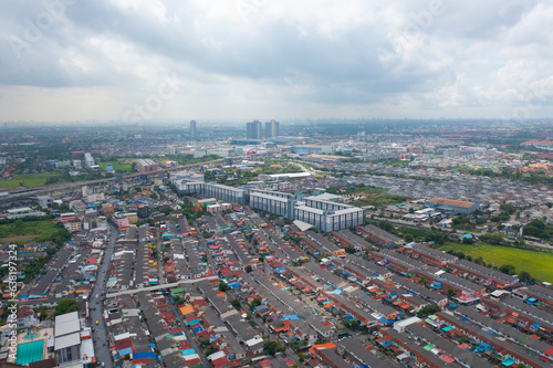 Aerial view of residential neighborhood roofs. Urban housing development from above. Top view. Real estate in Bangkok province city  Thailand. Property real estate.