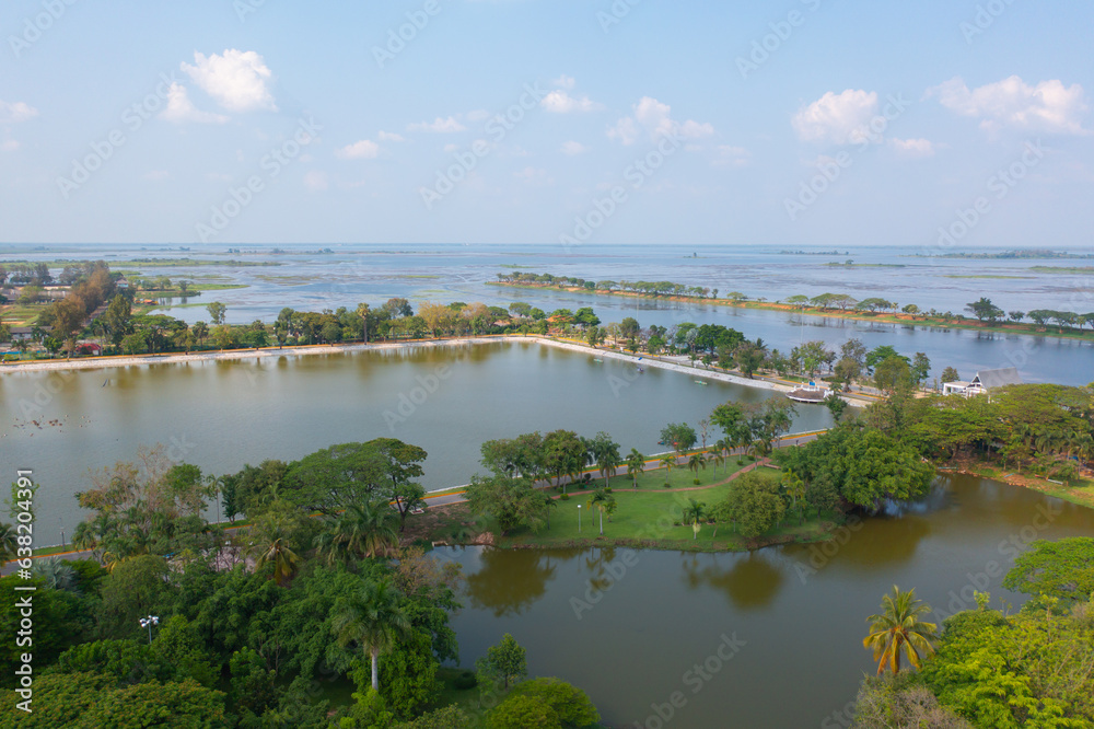 Aerial top view of a garden park with green forest trees, river, pond or lake. Nature landscape background, Thailand. Aerial top view of a garden park with green forest trees, river, pond or lake. Nature landscape background, Thailand.