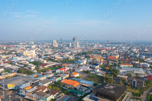 Fototapeta Naklejka Na Ścianę i Meble -  Aerial view of local residential neighborhood roofs. Urban housing development from above. Top view. Real estate in Isan, Khon Kaen urban city town, Thailand. Property real estate.