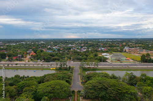 Aerial view of local residential neighborhood roofs. Urban housing development from above. Top view. Real estate in Isan urban city town, Thailand. Property real estate. © tampatra