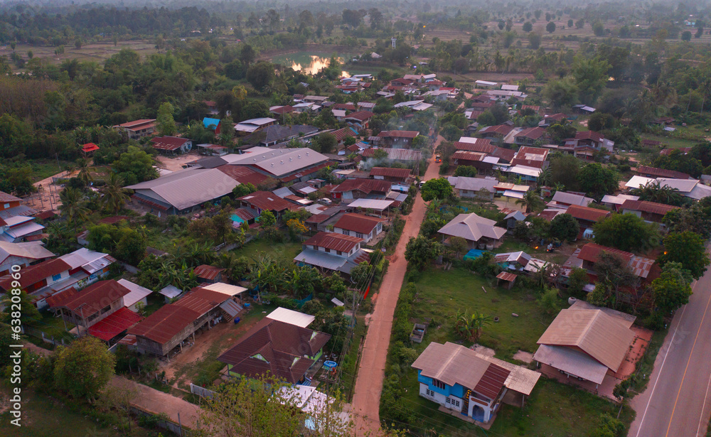 Aerial view of local residential neighborhood roofs. Urban housing development from above. Top view. Real estate in Isan urban city town, Thailand. Property real estate.