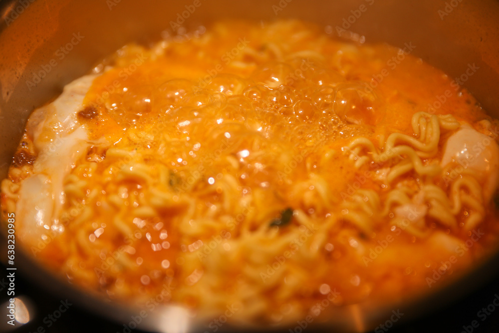 Ramen noodles, a culinary icon, simmering in cultural fusion. Chopsticks poised for gastronomic journey, uniting flavors and traditions Ramen noodles, a culinary icon, simmering in cultural fusion. Chopsticks poised for gastronomic journey, uniting flavors and traditions