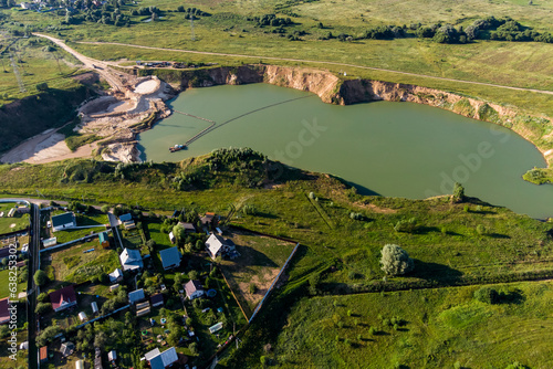 Aerial view of a flooded sand pit in the village of Trekhsvyatskoye, Zhukovsky district, Kaluga region, Russia photo