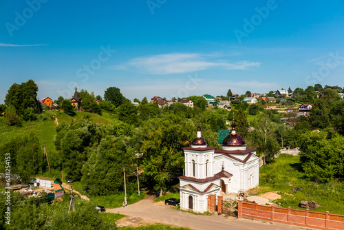 View from the Maloyaroslavets settlement to the surrounding rural landscape with a chapel and houses, Maloyaroslavets, Russia photo