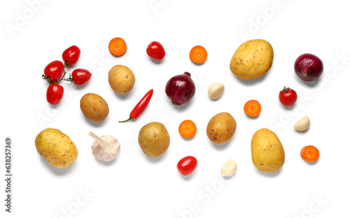Potatoes with onion, garlic and cherry tomatoes on white background