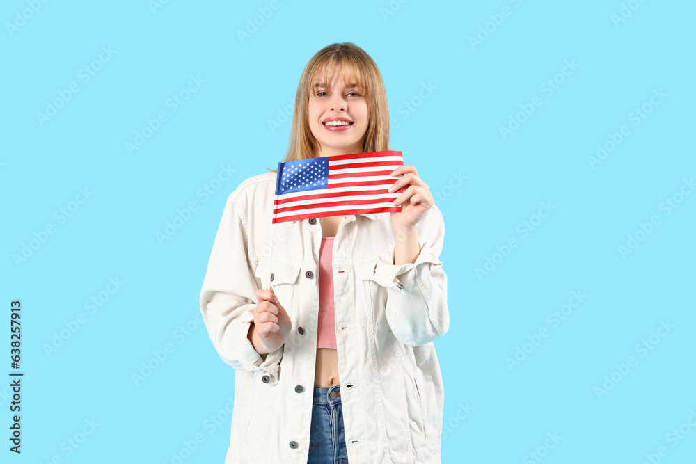Teenage girl with USA flag on blue background Teenage girl with USA flag on blue background
