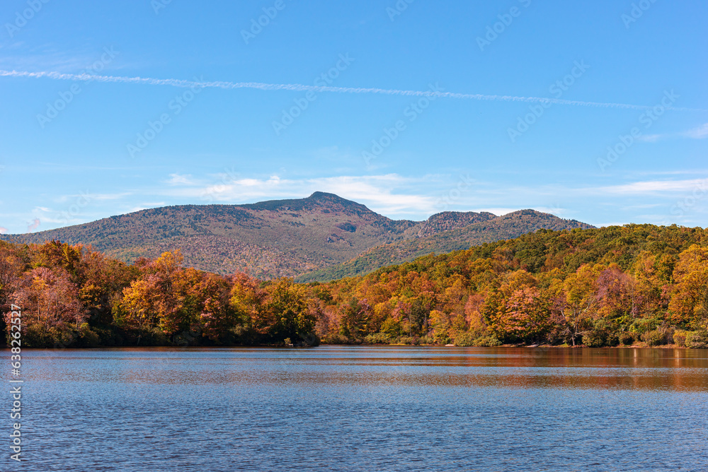 View of Price Lake in Julian Price Park on Blue Ridge Parkway near Blowing Rock, North Carolina in fall season. View of Price Lake in Julian Price Park on Blue Ridge Parkway near Blowing Rock, North Carolina in fall season.