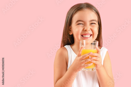 Cute little girl with glass...