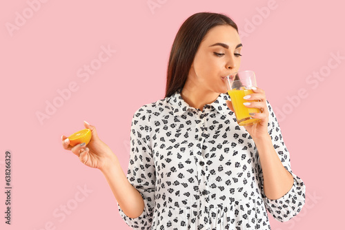 Young woman with orange dri...